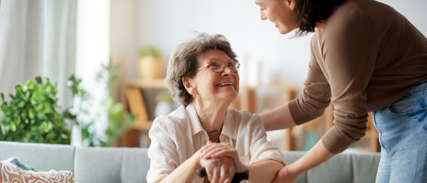 Family caregiver spends time with senior woman