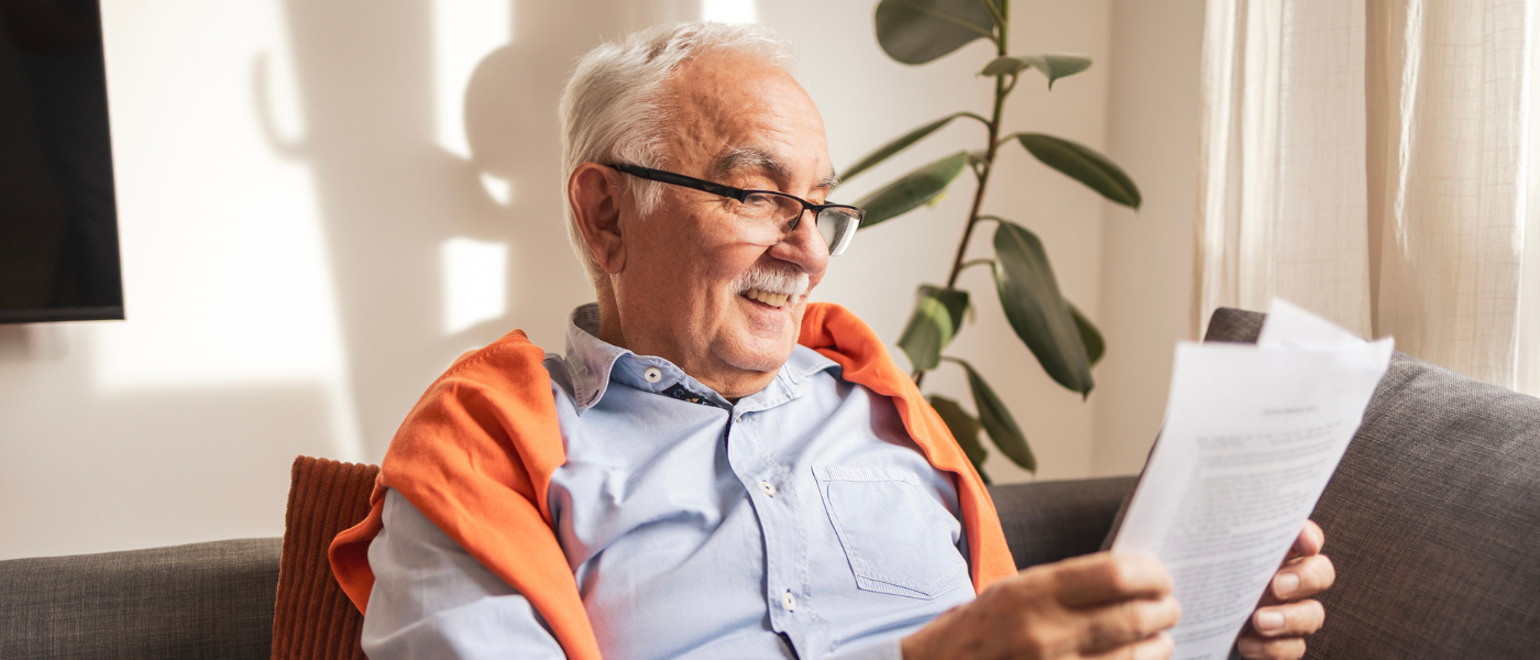 Older adult happily reading