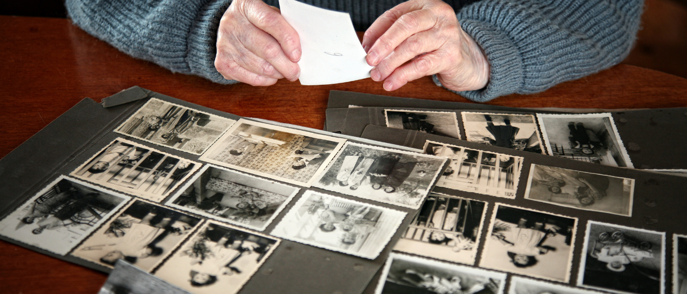 Older woman looking through family photos